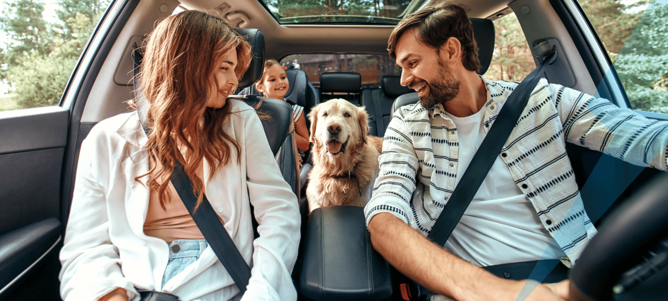 Family with dog in car