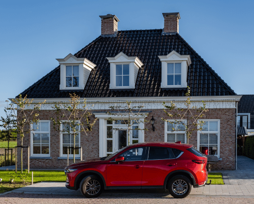 car in front of house