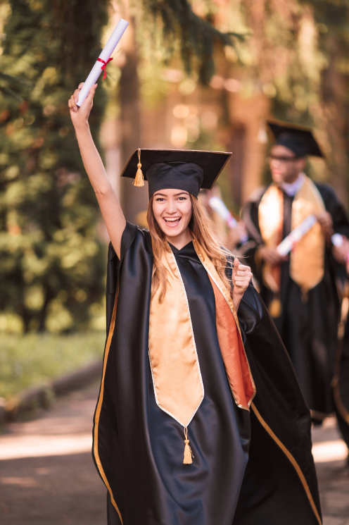 girl walking with her diploma