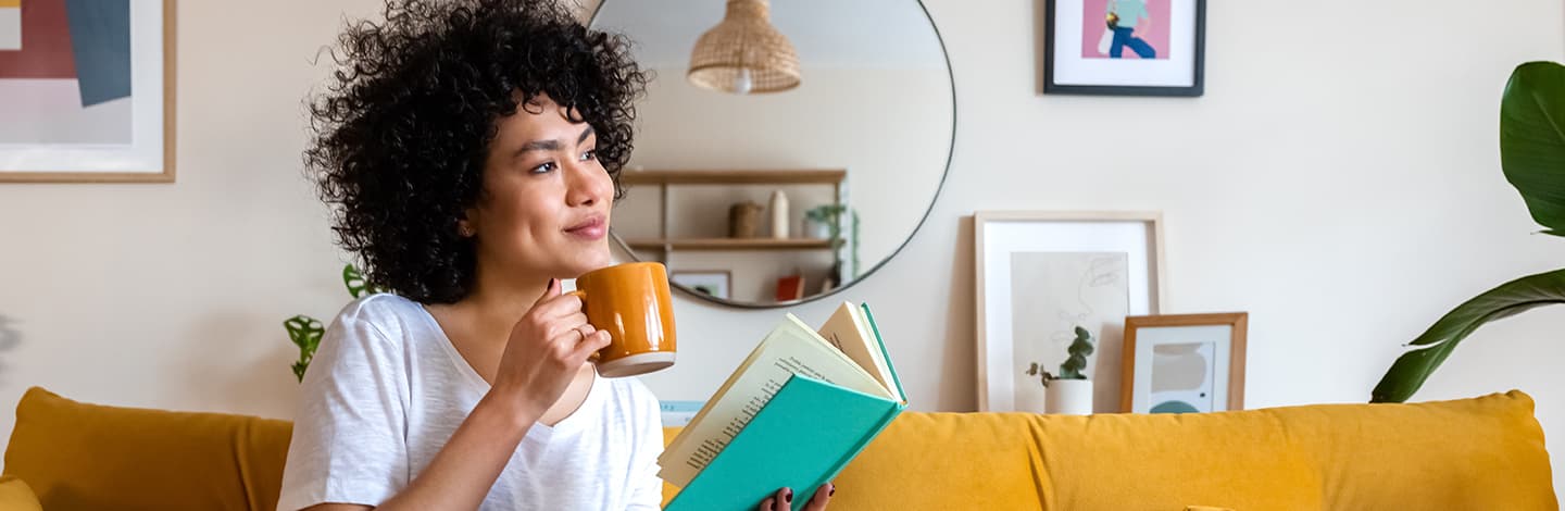 Women drinking coffee and reading a book