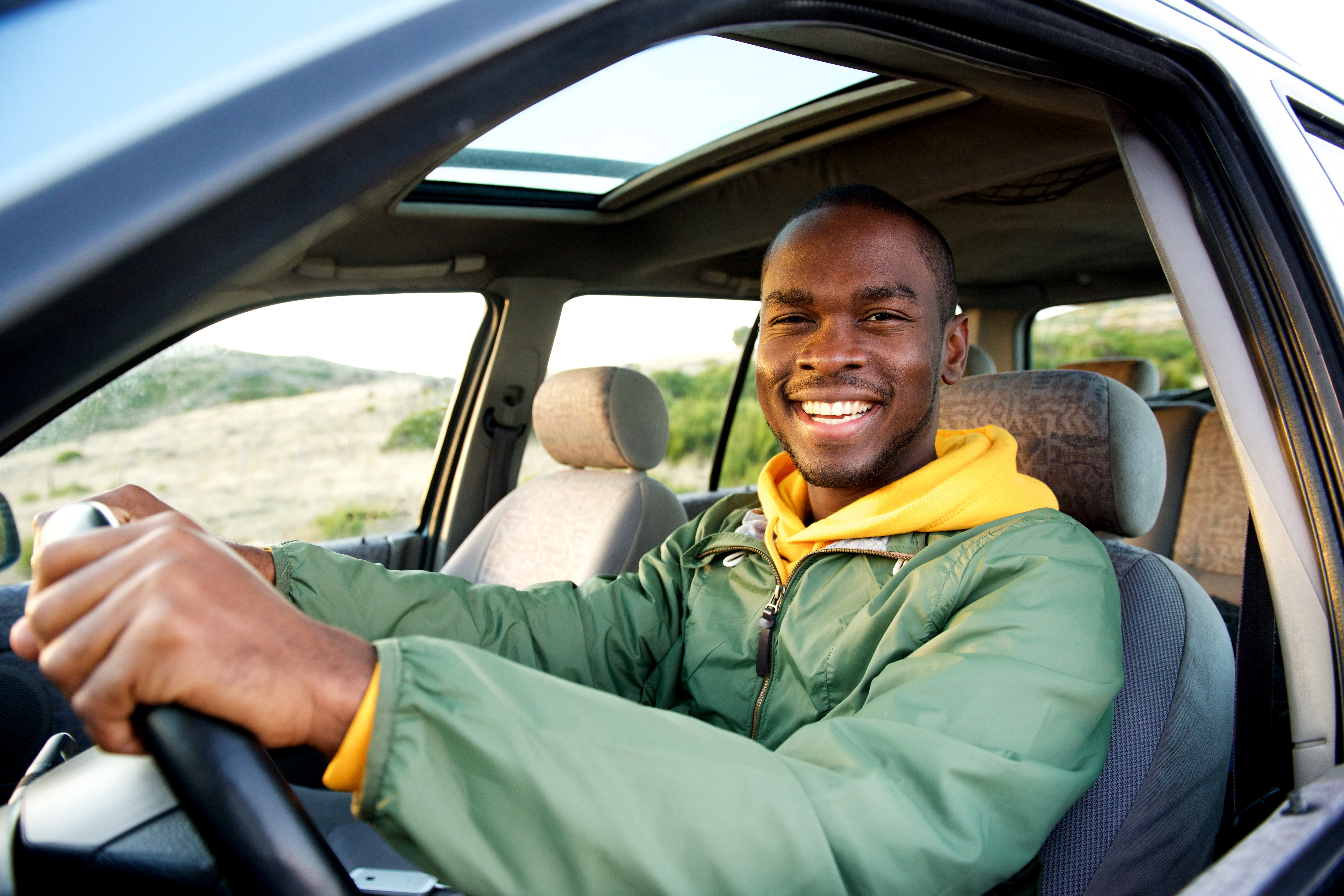 man in car